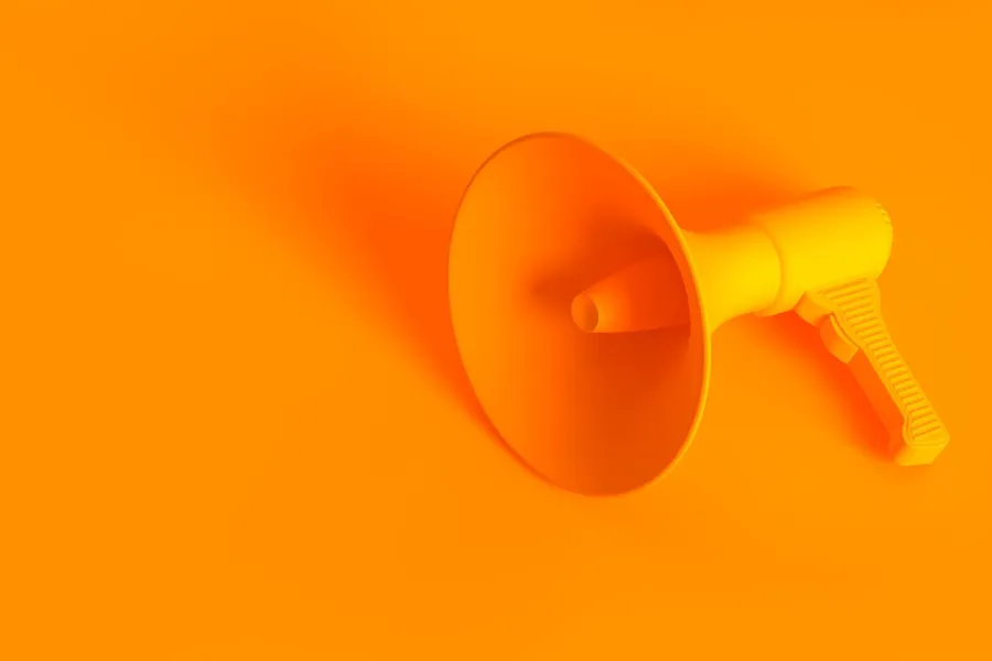 En gul sirkel med en hvit sirkel i midten