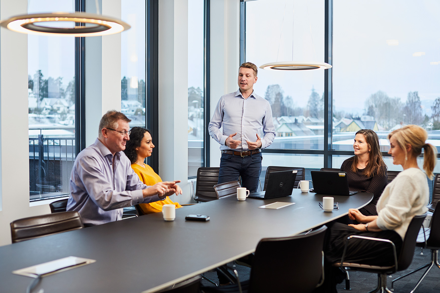 A group of people sitting around a table